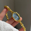 Oval Mother-of-Pearl Bracelet Watch - Gold Band with Blue Face [ML85VZR1]