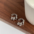 Rosanna Luxe Twist Earrings - Silver [OXHCVIAG]