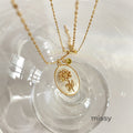 Anslee Mother-of-Pearl Birth Flower Necklace [EMXTQRME]