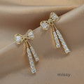 Macee Gold Zircon Bow Earrings [O5JJ49GK]