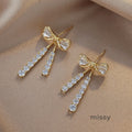 Macee Gold Zircon Bow Earrings [EEXWGI11]