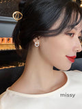Nayah Pearl Bow Earrings
