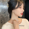 Nayah Pearl Bow Earrings