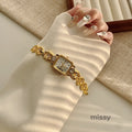 Parnika Gold Rectangle Watch [FJ6HZTAZ]