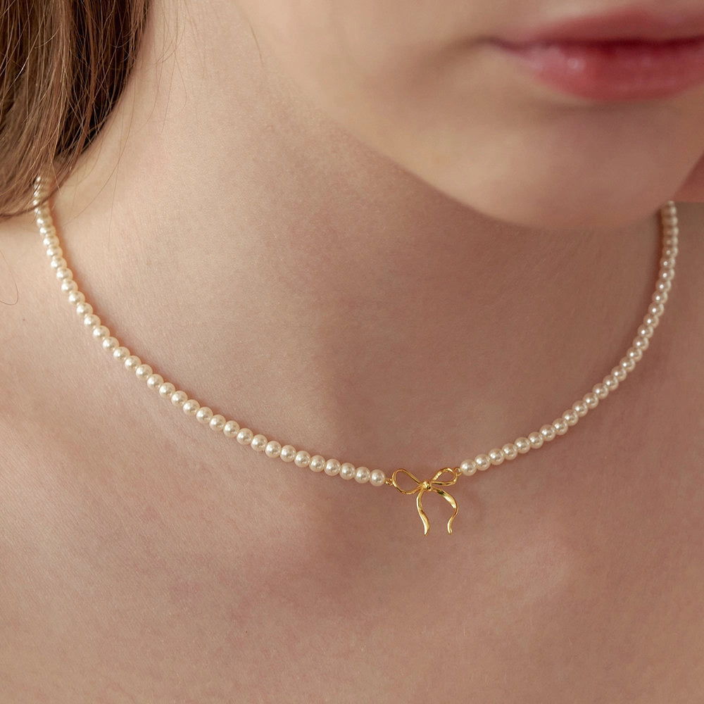 Pearl Bow Pendant Necklace [XC660CJ7]