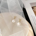 Pearl Bowknot Stud Earrings [XXAQ08FM]