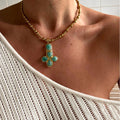 Pebble Cross Pendant Necklace [HEU40QVM]