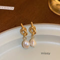 Ridhi Gold Asymmetric Pearl Studs [O6ONFLPG]