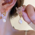 Ridhi Gold Asymmetric Pearl Studs [OY2JAA2D]